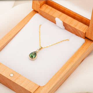 Pear Cut Australian Green-Blue Parti Necklace with a Diamond in Yellow Gold by World Treasure Designs