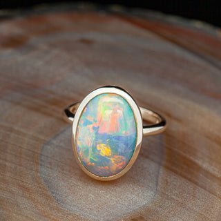 Multicoloured Australian Semi Black Bezel Set Opal Ring in Yellow Gold by World Treasure Designs