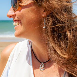 Playful Fluke Whale Tail Pendant Necklace in Sterling Silver by World Treasure Designs