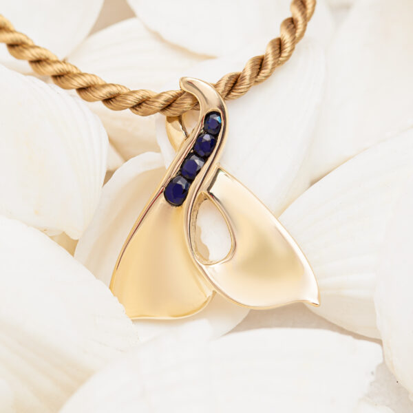 Eternity Fluke Whale Tail Necklace with Blue Sapphires in Yellow Gold by World Treasure Designs