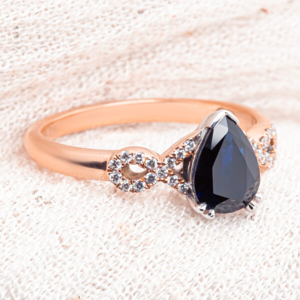 Pear Blue Sapphire Ring with Diamonds in Rose Gold by World Treasure Designs