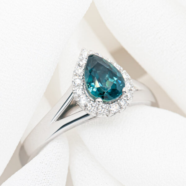Australian Blue-Teal Pear Cut Sapphire Ring with Diamond Halo in White Gold by World Treasure Designs