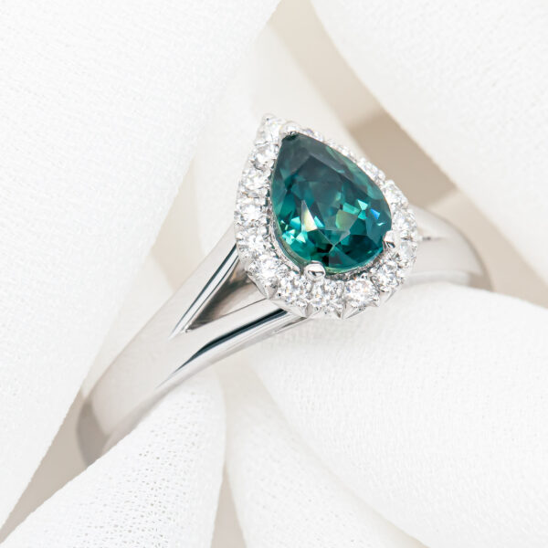 Australian Teal Pear Cut Sapphire Ring with Diamond Halo in White Gold by World Treasure Designs
