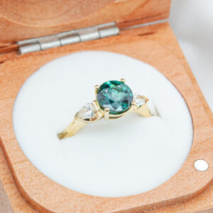 Australian Blue-Green Sapphire with Two Diamonds Pear Cut in Yellow Gold by World Treasure Designs