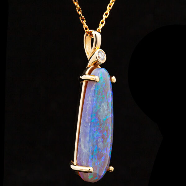 Elongated Australian Blue-Green Black Opal Pendant with a Diamond in Yellow Gold by World Treasure Designs