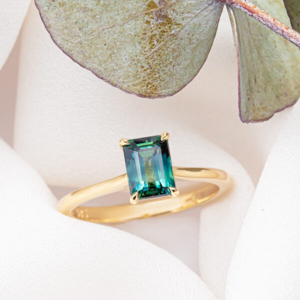 Emerald Cut Blue-Green Parti Sapphire Ring in Yellow Gold by World Treasure Designs