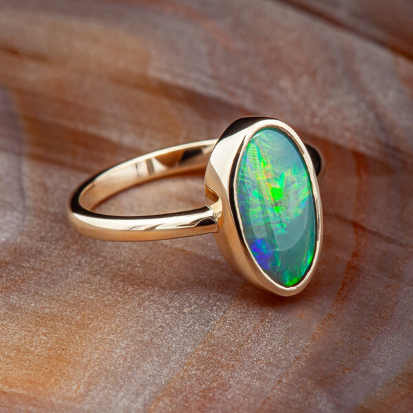 Green-Blue Australian Crystal Opal Bezel Set Ring in Yellow Gold by World Treasure Designs