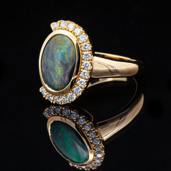 Australian Semi-Black Opal and Partial Diamond Halo Ring in Yellow Gold by World Treasure Designs