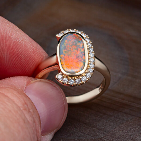 Australian Semi-Black Opal and Half Diamond Halo Ring in Yellow Gold by World Treasure Designs