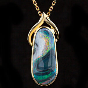 Oval Australian Semi-Black Swirl Opal Necklace in Yellow Gold by World Treasure Designs