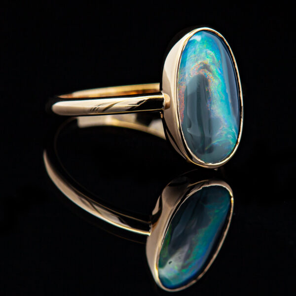 Australian Fossil Semi-Black Opal that is Bezel Set in Yellow Gold by World Treasure Designs