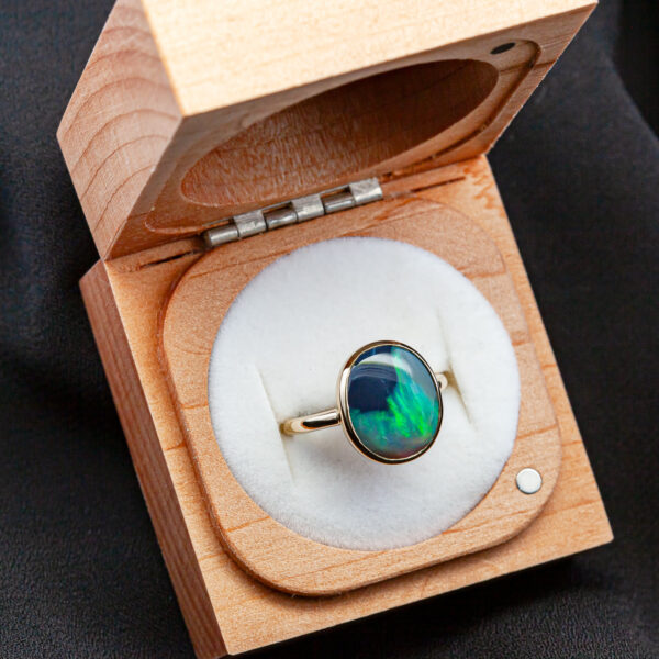 Australian Semi-Black Opal Ring with Blue Green and Aqua Colours Bezel Set in 9ct Yellow Gold by World Treasure Designs