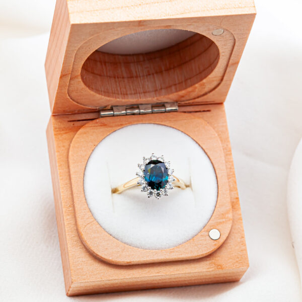 Oval Australian Blue Sapphire Ring with Halo of Diamonds in Yellow and White Gold by World Treasure Designs